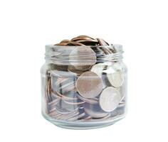 Coins in glass jar isolated on white background with clipping path, Business finance saving money banking investment concept. photo