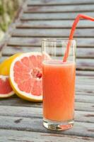 A glass of fresh grapefruit  juice photo