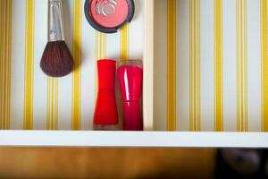 Open drawer of a woman's mirror table. photo