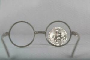 View at bitcoin through eyeglasses photo