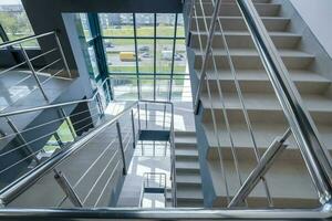 stairs emergency and evacuation exit stair in up ladder in a new office building. photo