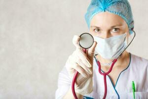 A professional stethoscope in the hand of a doctor. Closeup photo