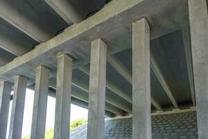 concrete columns like pillars of an automobile bridge photo