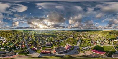 aerial hdri 360 panorama view over provincial town from great height at evening in equirectangular seamless spherical  projection. may use like sky replacement for drone 360 panorama photo