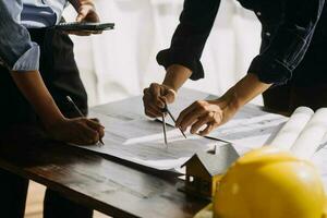 architect man working with laptop and blueprints,engineer inspection in workplace for architectural plan,sketching a construction project ,selective focus,Business concept vintage color photo