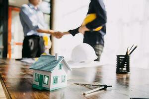 architect man working with laptop and blueprints,engineer inspection in workplace for architectural plan,sketching a construction project ,selective focus,Business concept vintage color photo