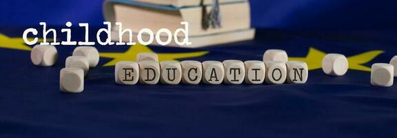 Words CHILDHOOD  EDUCATION composed of wooden letters. photo