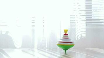 Colorful spinning top moving on a table with transparent curtain on the background. video