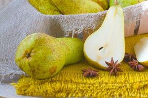 Green pears on a sackcloth photo