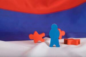 Wooden figures on Russian flag. photo