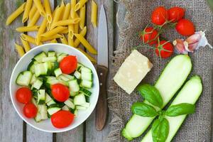 Ingredients for preparing Italian pasta dish. Top view photo