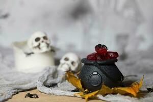 Trick or treat - Candies in cauldrons for Halloween. photo