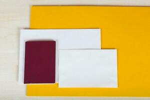 Passport, blank white envelopes on post mail. photo