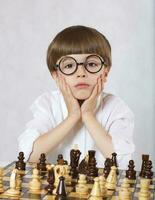 Boy is playing chess photo