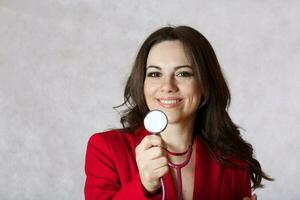 Young woman with a stethoscope. Closeup photo