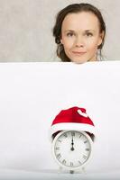 Young lady in Santa Claus hat photo