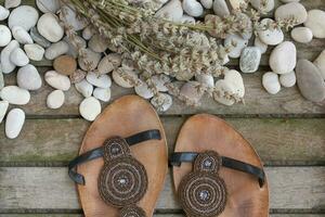 Womens summer shoes on a wooden surface. Background. photo