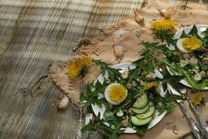 Dandelion salad on a white plate. photo