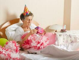 Senior woman celebrates her birthday photo