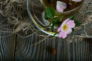 Fresh rose hip on a cup plate. photo