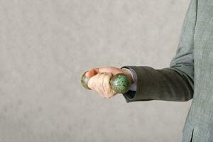 A man with a dumbbell in his hand. Closeup photo