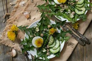 Dandelion salad on a white plate. photo