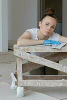 Young lady renovates  apartment photo