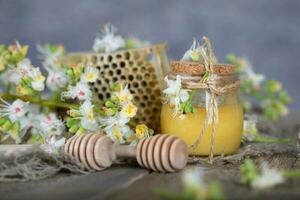 Chestnut honey on a wooden surface. photo