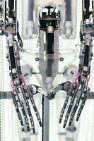 Five fingered robot arm and hands close up. Robotic technology photo
