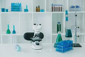hand of scientist with test tube and flask in medical chemistry lab blue banner background photo