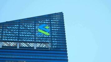 Singapore 1 june 2022. standard chartered bank logo on financial building video