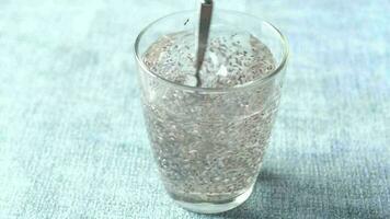 Close up of chia seeds in a glass of water video