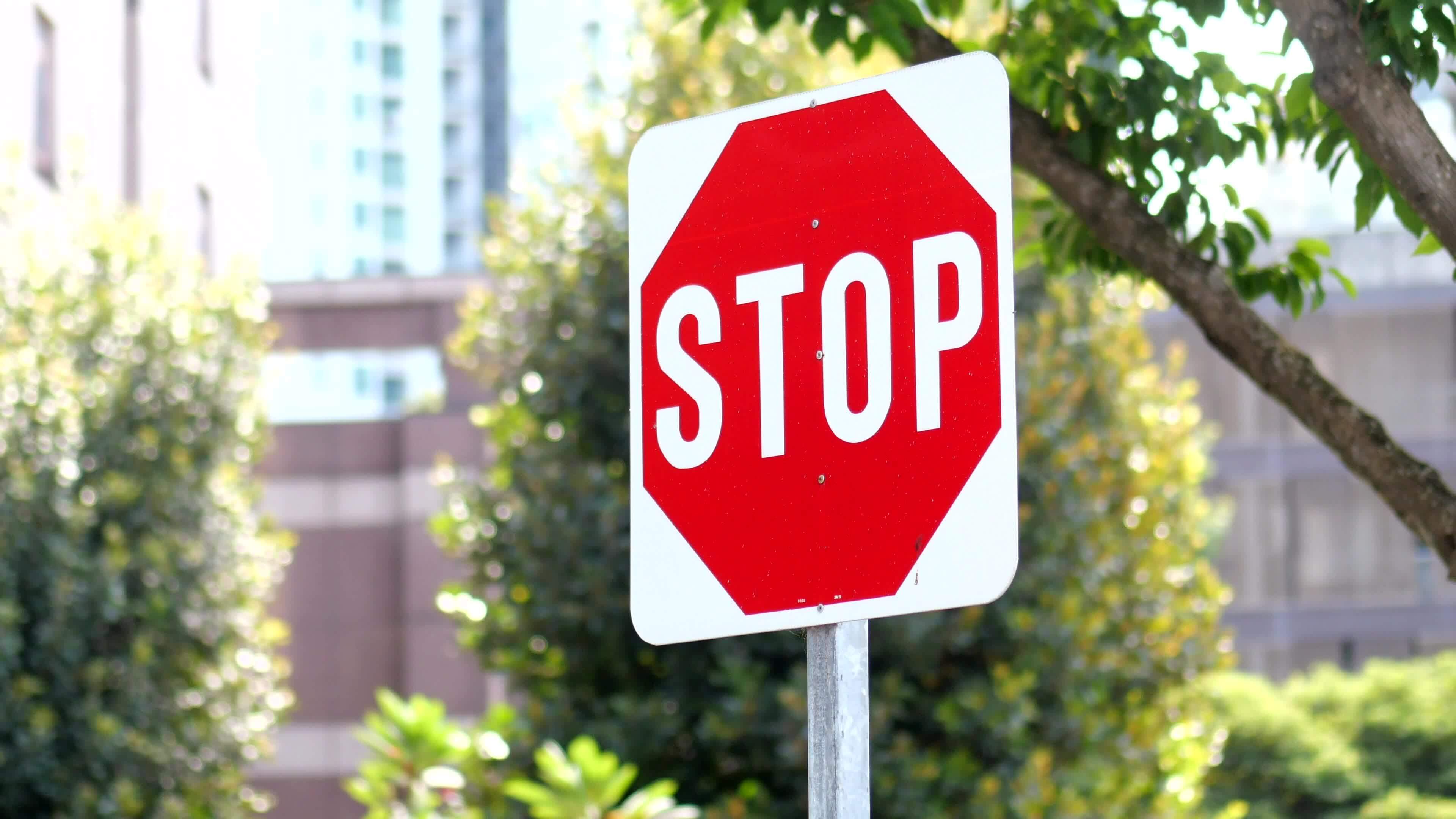 Stop sign in a empty road 24997930 Stock Video at Vecteezy