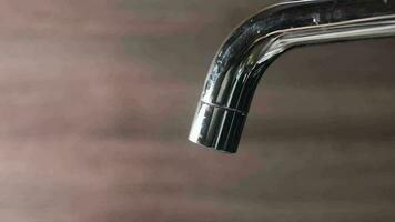 Close up of faucet with flowing water video