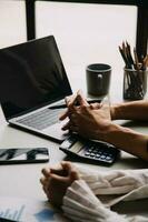 Financial Business team present. Business man hands hold documents with financial statistic stock photo, discussion, and analysis report data the charts and graphs. Finance Financial concept photo
