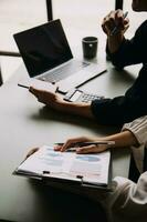 Financial Business team present. Business man hands hold documents with financial statistic stock photo, discussion, and analysis report data the charts and graphs. Finance Financial concept photo
