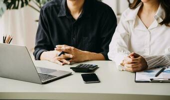 Financial Business team present. Business man hands hold documents with financial statistic stock photo, discussion, and analysis report data the charts and graphs. Finance Financial concept photo