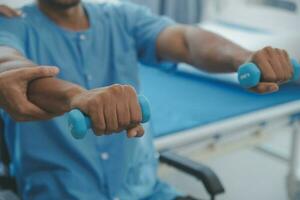 Physical therapist guiding patient with resistance band photo