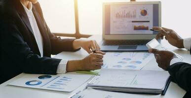 businessman working on desk office with using a calculator to calculate the numbers, finance accounting concept photo