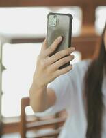 Shot of a asian young business Female working on laptop in her workstation. photo