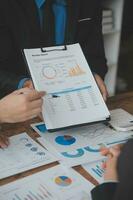 Team of business people working together in the meeting room office, teamwork background charts and graphs banner, double exposure successful teamwork,business planning concept. photo