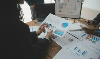 Team of business people working together in the meeting room office, teamwork background charts and graphs banner, double exposure successful teamwork,business planning concept. photo