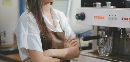 Barista make coffee latte art with espresso machine in cafe vintage color tone photo