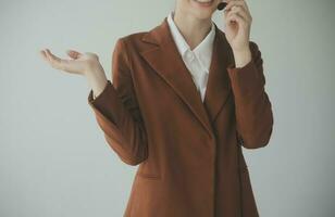 Customer service representative with curly hair talking through headset photo