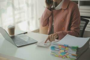 Audit concept,Administrator business man financial inspector and secretary making report calculating balance. Internal Revenue Service checking document. photo