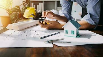 Diverse Team of Specialists Use Tablet Computer on Construction Site. Real Estate Building Project with Civil Engineer, Architect, Business Investor and General Worker Discussing Plan Details. photo