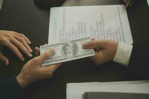 Business and lawyers discussing contract papers with brass scale on desk in office. Law, legal services, advice, justice and law concept picture with film grain effect photo