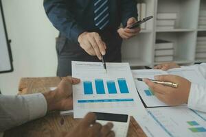 Team of business people working together in the meeting room office, teamwork background charts and graphs banner, double exposure successful teamwork,business planning concept. photo