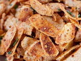 close up of basreng or spicy chips made from fried baso. A typical Sundanese, Indonesian spicy crispy snack. photo