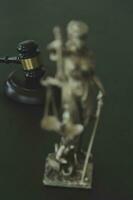 Justice and law concept.Male judge in a courtroom with the gavel, working with, computer and docking keyboard, eyeglasses, on table in morning light photo